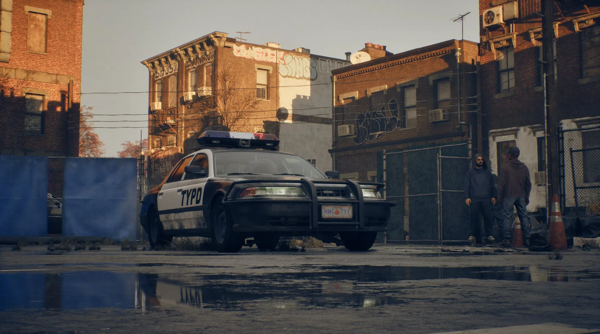 A parked police car by the kerb.